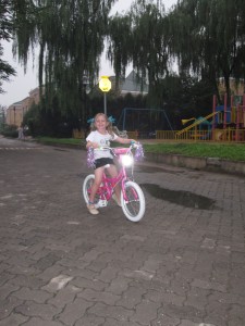 Here's Gigi on her little pink number sans training wheels!