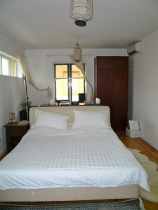 I divided my room up in two: there's a little changing area for myself behind the bed.