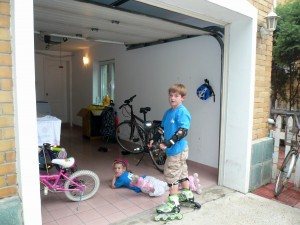 The garage is replete with goods: bikes, rollerblades, balls, hula hoops, or and a washer and dryer!